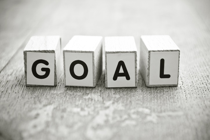 A bunch of cubes with the word GOAL printed on it